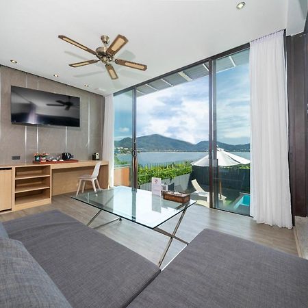 Indochine Resort And Villas - Sha Extra Plus Patong Bagian luar foto A living room at the hotel