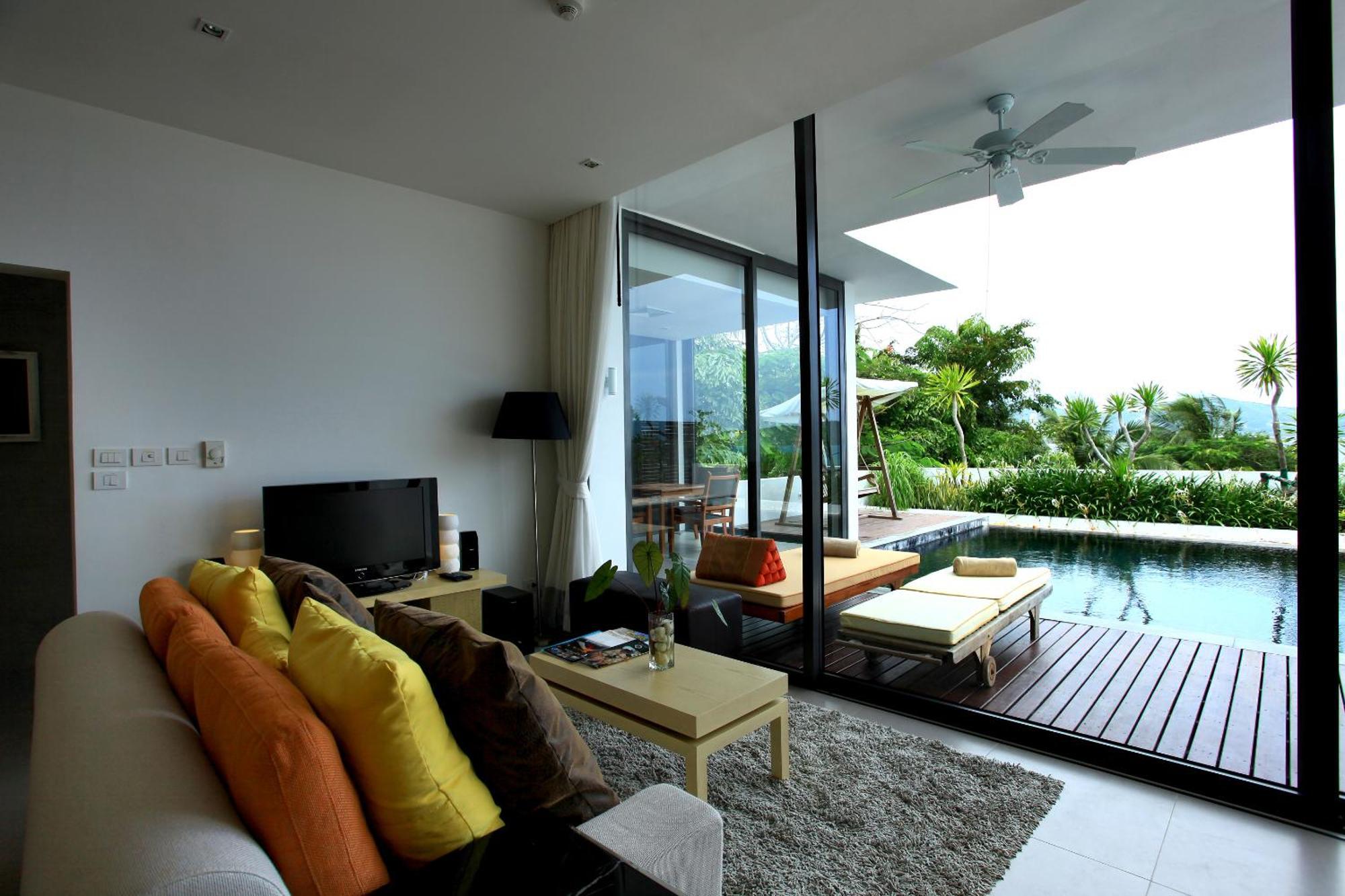 Indochine Resort And Villas - Sha Extra Plus Patong Bagian luar foto A living room with a view of the pool