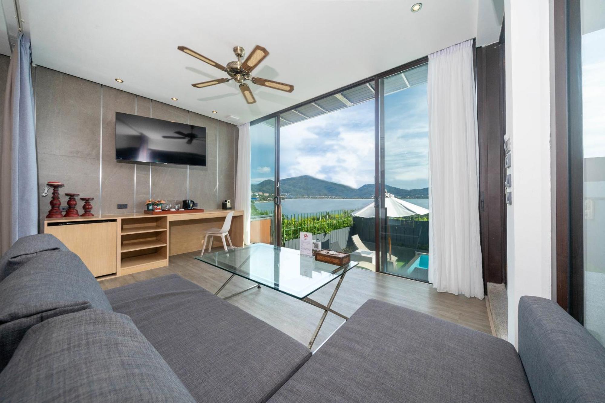 Indochine Resort And Villas - Sha Extra Plus Patong Bagian luar foto A living room at the hotel